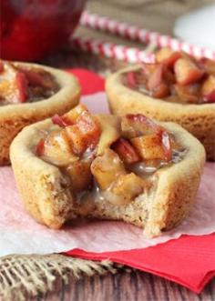 These Caramel Apple Cookie Cups are my first real taste of fall! A brown sugar cookie cup is filled with caramel, then topped with cinnamon apples and it is SO good!