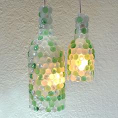 Repurpose those wine bottles by turning them into glass pebble pendant lights!