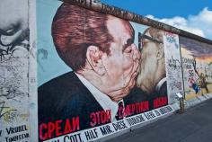 Famous painting on East Side Gallery of Berlin Wall, depicting East German President Erich Honnecker and Leonid Brezhnev kissing.