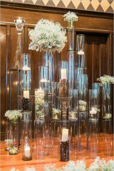 
                    
                        Loving this glass pillar wedding backdrop with candles!
                    
                