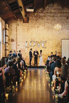 
                    
                        Spell out a message with balloons for a creative wedding ceremony backdrop | Brides.com
                    
                