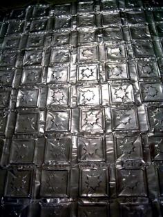 
                    
                        Press Aluminum Cans into Ceiling and Wall Tiles
                    
                