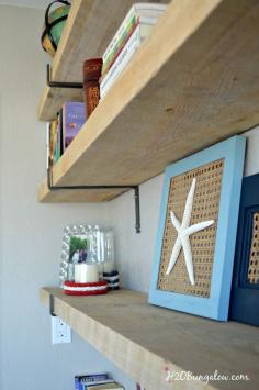 
                    
                        Make a reading nook with DIY Industrial rough cut wood shelves with hand made shelf brackets.  I turned an unused odd wall into floor to ceiling shelving.  I looks great in our  small spaces! See my design tips for designing your own DIY industrial rough cut shelves. Way less expensive than the ordering them from West Elm or other pricey stores.  H2OBungalow #shelves #smallhomebigstyle
                    
                