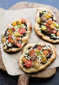 
                    
                        This eye-catching and colorful pizza gets a good amount of saltiness from the feta and the rich olive tapenade sauce, which is balanced by tart tomatoes and fragrant basil.
                    
                