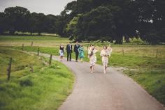 
                    
                        Bridemaids walking down country lane - Charming English Country Wedding by Amy Shore Photography - via Magnolia Rouge
                    
                