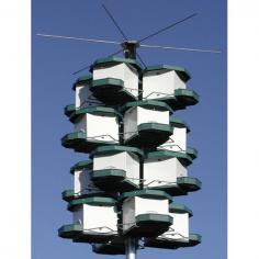 The Heritage Farms Purple Martin House with Pole System it the ultimate birdhouse community! It features 4 easy-to-assemble stackable quad pod nesting units and hub, 8" x 8" compartments with internal predator guard, exercise perch, and ventilation slits. It also has a removable roof and includes mounting hardware. Made in the USA.