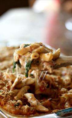 Baked Chicken Pesto Alfredo Freezer Meal- made with chicken, basil pesto, bacon, cheese, spinach and tomatoes mixed together in a delicious white sauce. So good!!