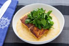 Blackened Drum over Cheddar Cheese Grits with Sorrel, Parsley & Chive Salad