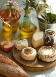 audreylovesparis:  Rosé wine, baguette, cheese, homemade jam, fresh fruit, olive oil & herbs - a perfect French meal.