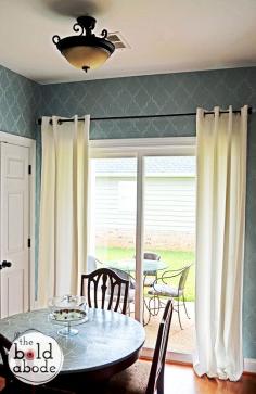 Add some simple elegance with simple white curtains.