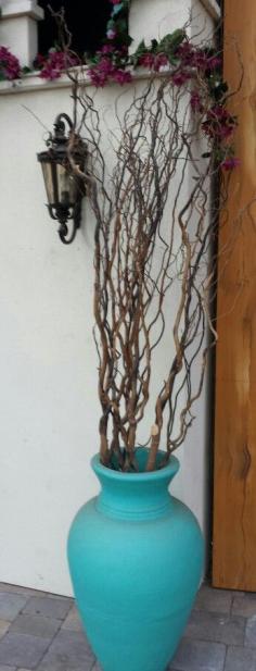 There's no shame in plopping some gnarly branches in a decorative pot, especially in hard to grow area's.  By the way, have visited my newly landscaped website?  It's www.ThingsGreen.com