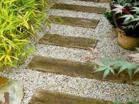 HGTV Gardens shows off the many ways gravel, pebbles, bark chips and other soft surfacing materials can look amazing in a garden design.