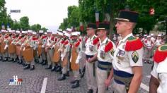 THE FRENCH FOREIGN LEGION IN THEIR FAMOUS LEATHER APRONS PREPARE FOR THE MILITARY PARADE OF THE 14 JUILLET.  It us à military parade, and tanks, missiles, guns, and sophisticated military equipment will be on display. Overhead, France's sophisticated fighter jets armed with missiles and helicopters will fly over.