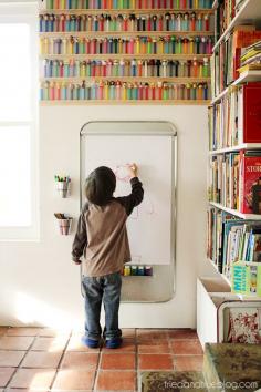 Use a few unrelated supplies to create the perfect art center for your kids! Includes material list and suggestions where to find them. #kidsroom #art