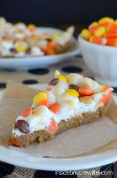 This giant peanut butter cookie topped with melted marshmallows and candy corn is a delicious and fun treat for fall parties.