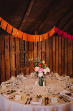 barn reception with fringe garland, photo by Veronica Varos ruffledblog.com/... #weddingideas #receptions