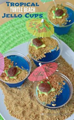 Tropical turtles bask on a sandy graham cracker beach in these adorable and fun blue raspberry Jello cups.