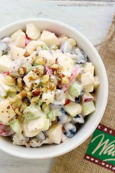 Traditional Waldorf Salad is full of fresh apples, celery, grapes and walnuts in a mayonnaise dressing. Serve it as a side dish or appetizer. You can easily add chicken or turkey to make it a complete meal! #CAwalnuts #salad #fruit