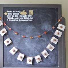 
                        
                            Little canvas squares and found acorns make a cheap, but pretty garland for fall!
                        
                    