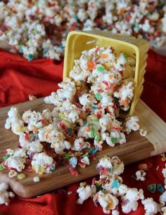 Fruity Pebble Kettle Corn.  A yummy and easy kettle recipe, drizzled with white candy coating and Fruity Pebble Cereal.  Completely sweet and totally addicting!