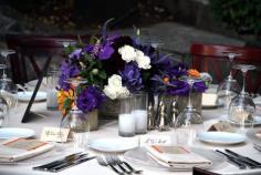 
                    
                        Purple & orange wedding reception centerpieces. Dahlias, lisianthus, orchids, veronica, kumquats — at Kenwood Inn & Spa.
                    
                