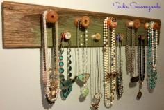 Attaching antique / vintage wooden spools to a piece of salvaged wood creates a unique, attractive, and effective rack for your necklaces and jewelry. #sadieseasongoods