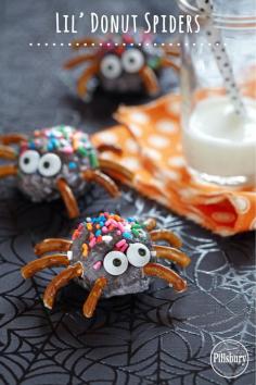 Spooky snack for Halloween. Kids will love! Stick pretzel pieces and candy eyes on Pillsbury® Funfetti® Chocolate Glazed Lil’ Donuts. #lildonutspromo
