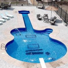 
                    
                        This dedicated guitar collector was just shopping for a hot tub — but, in the end, couldn't resist requesting the swimming hole of his dreams.
                    
                