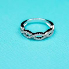 
                    
                        14K white gold Infinity Twist diamond band by Masterjeweler
                    
                