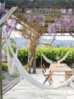 
                    
                        The inspiration for DIY blogger Bonnie Forkner's low-key backyard patio began with the beautiful wisteria that had already been planted there.
                    
                