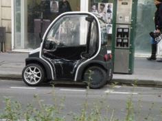 
                    
                        Electric car recharging in a street of Paris
                    
                