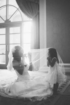 
                    
                        An adorable shot of the bride with the flower girl.
                    
                