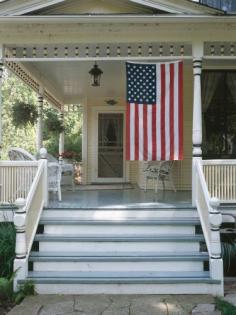 
                    
                        Show off your national pride and add some Americana flair to your decor by hanging a flag as your porch's focal point.
                    
                