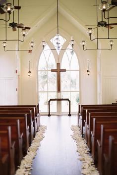 
                    
                        A ceremony aisle decorated with rose petals | Brides.com
                    
                