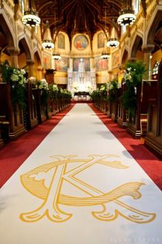 
                    
                        A custom monogrammed aisle runner | @Allan Zepeda | Brides.com
                    
                