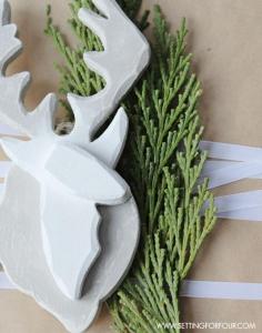
                    
                        Easy painted Deer Ornament DIY inspired by a winter woodland look! This semi-handmade deer ornament is quick to make and a great tree ornament, stocking stuffer, teacher gift or present topper.  www.settingforfou...
                    
                