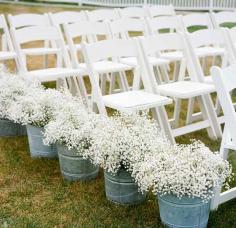 
                    
                        Line aisle with Baby's breath then move the flowers to reception area to place on tables. WeddingWoman.net
                    
                