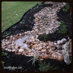 
                    
                        The dry creek swale doing its job during this week's rain. // beanandbee.com
                    
                