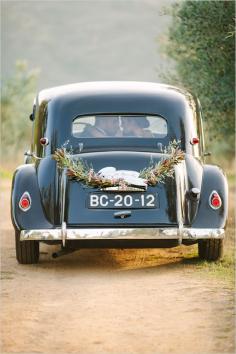 
                    
                        Vintage wedding getaway car.
                    
                