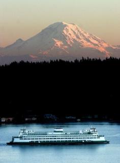 
                    
                        Ferry from Seattle to Bremerton passes under Mt. Rainier, Washington State
                    
                