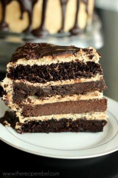 
                    
                        The Ultimate Chocolate Peanut Butter Cake -- a fudgy chocolate cookie and a luxurious chocolate cheesecake sandwiched between 2 super moist cake layers! www.thereciperebe...
                    
                