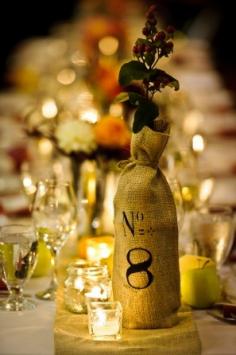
                    
                        cover wine bottles in burlap or fabric for centerpieces or table markers! Turns them into cool accent vases, and you don't have to worry about them all being the same
                    
                