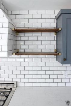 
                    
                        Open shelves and white subway tile backsplash in a home flip on dreambookdesign.com
                    
                