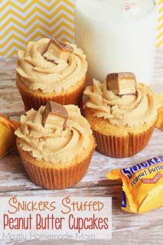 
                    
                        Snickers Stuffed Peanut Butter Cupcakes - These yummy cupcakes start with a cake mix, are filled with SNICKERS peanut butter squares and topped with creamy sweet peanut butter frosting!
                    
                