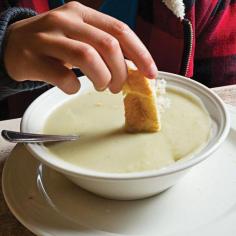 
                    
                        DUARTE'S CREAM OF ARTICHOKE SOUP   2 tbsp. butter  2 cloves garlic, finely chopped  1 small onion, finely chopped  2 lb. frozen artichoke hearts, thawed and roughly chopped  3 cups chicken stock  2 cups heavy cream  Kosher salt and freshly ground black pepper, to taste  Lemon wedges, for serving
                    
                