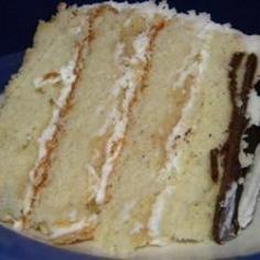 
                    
                        Cake flour, butter, egg whites, and milk are mixed with vanilla and almond extracts in this classic white cake recipe.
                    
                