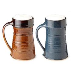 
                    
                        Highlighted by a tapered neck and hand-pulled handle, this stoneware vessel offers stylish insulation to keep hot beverages hot and a cold beer crisp 'til the end.
                    
                