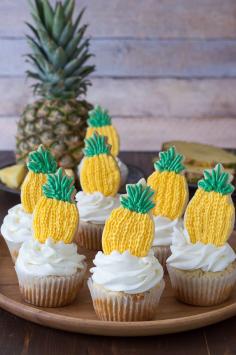 
                    
                        Pineapple Cupcakes - crushed pineapple in the batter and in the frosting! Top them with pineapple cookies or pineapple slices!
                    
                