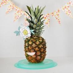 
                    
                        Create fun party decor for your next event from a simple Pineapple and some scrapbook paper!
                    
                
