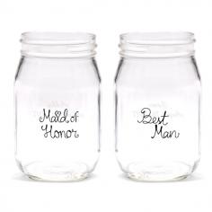 These bridal party beverage glasses make great gifts for all the friends and family standing with you on your big day. The 16 ounce glass mason jars are imprinted in black with the bridal party position and then you can optionally add two lines of custom engraved text to the back on the jar. Features Glass beverage jars with black wording "Maid of Honor" and "Best Man". Size - 5 1/8 in. tall Holds 16 ounces. Set of two.